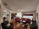 Open-concept living room featuring hardwood floors and comfortable seating area at 3215 Coconut Grove Rd, Land O Lakes, FL 34639