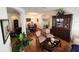 Open-concept living space showcasing hardwood floors, archways, and dining area at 3215 Coconut Grove Rd, Land O Lakes, FL 34639