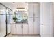 Bathroom featuring modern cabinets, a sink, and a walk-in shower with glass door at 32423 Rosewood Meadow Ln, Wesley Chapel, FL 33543
