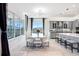 Modern dining room with a large window providing natural light and a view of the backyard at 32423 Rosewood Meadow Ln, Wesley Chapel, FL 33543