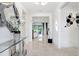 Bright foyer featuring tile flooring, modern decor, and an open view of the living spaces at 32423 Rosewood Meadow Ln, Wesley Chapel, FL 33543