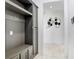 Mudroom with built-in storage and seating, providing organization and style at 32423 Rosewood Meadow Ln, Wesley Chapel, FL 33543