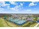 Multiple tennis courts with blue and green surfaces offer recreational opportunities for residents at 32423 Rosewood Meadow Ln, Wesley Chapel, FL 33543