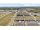 Aerial view of new townhomes with a peaceful water view, in a well-planned community at 33064 Tulip Petal Ln, Wesley Chapel, FL 33545