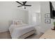Bright bedroom with neutral decor, ceiling fan, and stylish accents at 33064 Tulip Petal Ln, Wesley Chapel, FL 33545