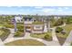 Welcoming entrance to a new community with stone accents, water feature, and lush greenery at 33064 Tulip Petal Ln, Wesley Chapel, FL 33545