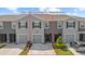Charming townhome with well-maintained landscaping and a welcoming entrance at 33064 Tulip Petal Ln, Wesley Chapel, FL 33545