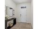 Bright foyer with console table, decorations, rug, and white front door at 33064 Tulip Petal Ln, Wesley Chapel, FL 33545