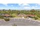View of the community playground with picnic tables and lush landscaping near the lake in a Gathering friendly neighborhood at 33064 Tulip Petal Ln, Wesley Chapel, FL 33545