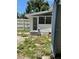 An enclosed porch can be accessed from the backyard at 38030 Howard Ave, Dade City, FL 33525