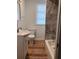 This bathroom is nicely remodeled with stone wall shower at 38030 Howard Ave, Dade City, FL 33525