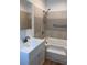 This bathroom features a shower-tub combo, modern fixtures and vanity storage at 38030 Howard Ave, Dade City, FL 33525