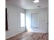 A bright bedroom with ample sunlight and hardwood floors at 38030 Howard Ave, Dade City, FL 33525