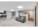 Cozy finished basement with seating area, bar, and decorative wall art at 405 Apache Trl, Brandon, FL 33511