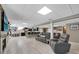 Large finished basement featuring tile flooring, lounge, fireplace, bar, and seating at 405 Apache Trl, Brandon, FL 33511