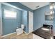 Modern bathroom featuring a granite countertop, and tiled floors that provide a luxurious and comfortable experience at 405 Apache Trl, Brandon, FL 33511
