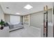 Cozy bedroom with a large window, neutral tones, and a built-in closet at 405 Apache Trl, Brandon, FL 33511