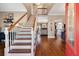 Grand foyer with hardwood floors, a staircase, and views into the living room and kitchen at 405 Apache Trl, Brandon, FL 33511