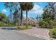 Beautiful home with a brick driveway, well-manicured lawn, and mature trees providing shade and privacy at 405 Apache Trl, Brandon, FL 33511