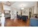 Elegant living room with hardwood floors, stylish furnishings, and ample natural light, creating a welcoming space at 405 Apache Trl, Brandon, FL 33511