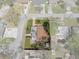 An aerial view shows this single Gathering home with a fenced in yard and a back patio at 4630 W Bay Villa Ave, Tampa, FL 33611