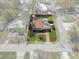 Aerial view of home showcasing the property's layout with yard and landscaping outlined at 4630 W Bay Villa Ave, Tampa, FL 33611