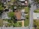 An aerial view of home showing yard, landscaping, driveway, and roof, providing a comprehensive overview at 4630 W Bay Villa Ave, Tampa, FL 33611