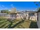 A spacious backyard with a brick patio and screened-in porch, perfect for relaxation and gatherings at 4630 W Bay Villa Ave, Tampa, FL 33611