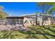 The backyard features a brick patio and a screened-in porch, an ideal spot for entertaining at 4630 W Bay Villa Ave, Tampa, FL 33611
