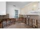 Bright kitchen with damage to the walls needing repairs for a homeowner to put their custom touch at 4630 W Bay Villa Ave, Tampa, FL 33611