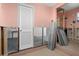 The laundry room features a door, water heater, screens, and water lines at 4630 W Bay Villa Ave, Tampa, FL 33611