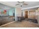 View of living room with view into kitchen and plenty of sunlight at 4630 W Bay Villa Ave, Tampa, FL 33611