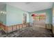 Bright living room featuring an open design to the next room allowing for easy movement, with damage to be repaired at 4630 W Bay Villa Ave, Tampa, FL 33611