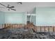 Spacious living room ready for renovation with natural light and ceiling fan at 4630 W Bay Villa Ave, Tampa, FL 33611