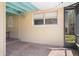 The exterior patio features pavers, screens and hanging lights enhancing the property's appeal at 4630 W Bay Villa Ave, Tampa, FL 33611