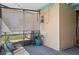 The backyard patio features pavers, hanging lights, screens and a colorful flower pot at 4630 W Bay Villa Ave, Tampa, FL 33611