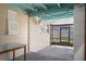 The patio is enhanced by hanging lights, a ceiling fan, and screens for relaxing or entertaining at 4630 W Bay Villa Ave, Tampa, FL 33611