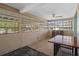 View of the sun room with many windows letting in natural light at 4630 W Bay Villa Ave, Tampa, FL 33611