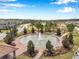 Aerial shot of a serene fountain and community park with walkways and landscaping at 5086 San Martino Dr, Wesley Chapel, FL 33543