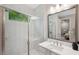 Bathroom with a glass-enclosed shower and modern vanity at 5086 San Martino Dr, Wesley Chapel, FL 33543