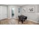 Cozy dining area with wood floors, a modern table, and stylish decor at 5086 San Martino Dr, Wesley Chapel, FL 33543