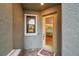Inviting entryway featuring a sidelight window and a decorative welcome mat at 5086 San Martino Dr, Wesley Chapel, FL 33543
