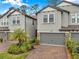 Charming townhomes with gray exteriors, brick driveways, and well-maintained landscaping, creating a welcoming curb appeal at 5086 San Martino Dr, Wesley Chapel, FL 33543