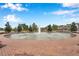 Community water fountain featuring a brick base and manicured landscaping at 5086 San Martino Dr, Wesley Chapel, FL 33543