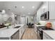 Bright, modern kitchen featuring stainless steel appliances, a gas range, and a center island with bar seating at 5086 San Martino Dr, Wesley Chapel, FL 33543