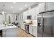 A well-appointed kitchen has an island, stainless appliances, white subway tile and a breakfast nook at 5086 San Martino Dr, Wesley Chapel, FL 33543