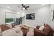 Bright living room with sliding door and hardwood floors at 5086 San Martino Dr, Wesley Chapel, FL 33543