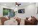 Spacious living room featuring a large sliding door to backyard at 5086 San Martino Dr, Wesley Chapel, FL 33543