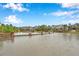 Beautiful pond view with lush landscaping and fountain features at 5086 San Martino Dr, Wesley Chapel, FL 33543