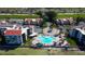 Aerial view of a waterfront condo community featuring a pool, golf course, and beach access at 5729 Puerta Del Sol Boulevard South # 486, St Petersburg, FL 33715